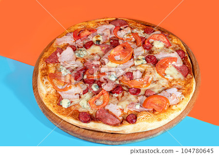 Pizza with bacon cheese and herbs on a wooden plate with cheese and cherry tomatoes. On a colored background. Pizza with bacon cheese and herbs on a wooden plate with cheese and cherry tomatoes. On a colored background. 104780645