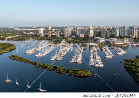 Aerial view Dinner Key Marina with Coconut Grove, Miami skyline in background. 104782044
