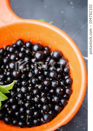 Blackberry in a sieve Blackberry in a sieve 104782102