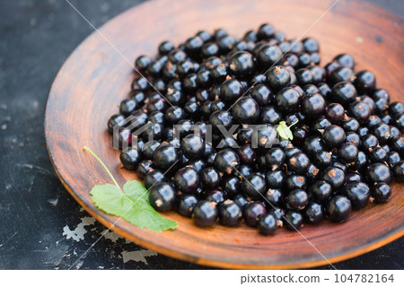 black currants in a large bowl black currants in a large bowl 104782164