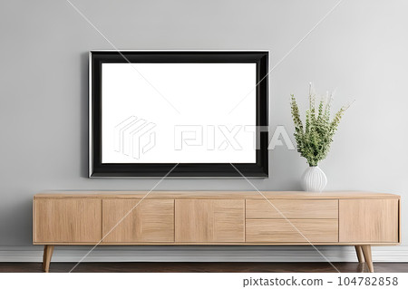 A mockup simple photo frame at the wall and a cabinet drawer. A mockup simple photo frame at the wall and a cabinet drawer. 104782858