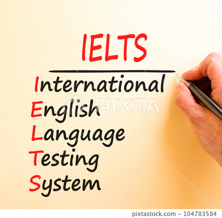 IELTS symbol. Concept words IELTS international english language testing system on white paper. Beautiful brown background. Business IELTS international english language testing system concept. 104783584