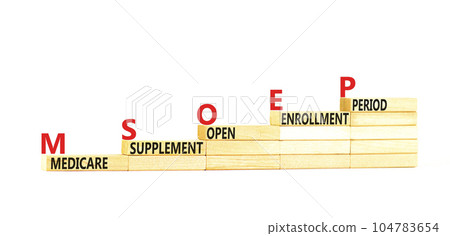 MSOEP symbol. Concept words MSOEP medicare supplement open enrollment period on wooden block. Beautiful white background. Medical MSOEP medicare supplement open enrollment period concept. Copy space. 104783654