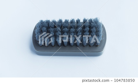 Multifunctional gray scrub plastic brush isolated on white background. Multifunctional gray scrub plastic brush isolated on white background. 104783850
