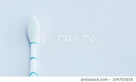 Blueish white toothbrush isolated on white. Blueish white toothbrush isolated on white. 104783858