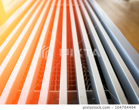 heating radiator close-up, concept of heating a residential building heating radiator close-up, concept of heating a residential building 104784494