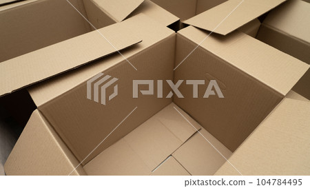 open cardboard boxes close-up, cutout for handle in cardboard box 104784495