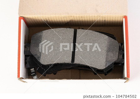 brake pads on white background with tinting 104784502
