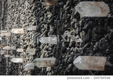 Wailing wall on Babi Yar, Kyiv, Ukraine. Holocaust memorial in Kyiv. Prayer wall in Babi Yar, Ukraine. Coal and crystal stones. Quartz crystal and rocks. Memorial alley. 104784506