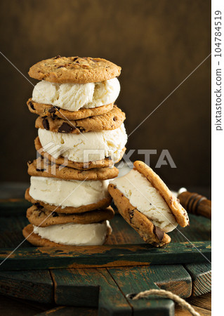 Homemade ice cream sandwiches with chocolate chip cookies 104784519