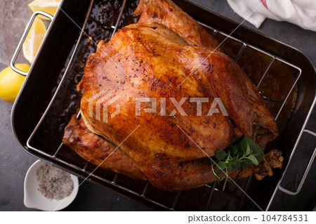 Cooked turkey ready for carving Cooked turkey ready for carving 104784531