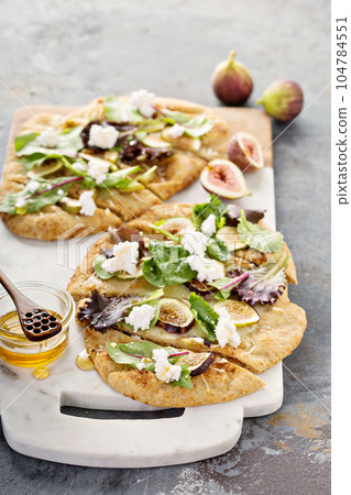 Fall flatbread pizza with fresh figs and goat cheese Fall flatbread pizza with fresh figs and goat cheese 104784551