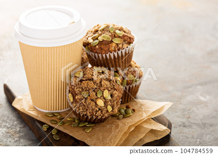 Healthy pumpkin muffins with coffee to go 104784559