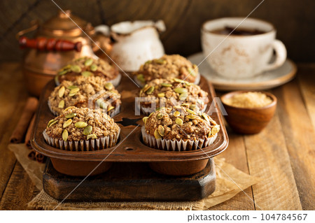 Healthy pumpkin muffins with seeds 104784567