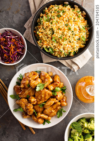 Spicy sweet and sour chicken with rice and cabbage 104784585