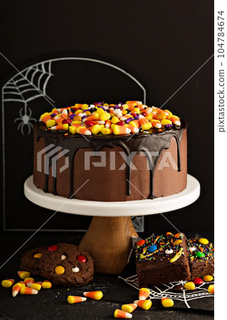 Halloween chocolate cake with candy on top 104784674
