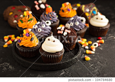 Festive Halloween cupcakes and treats 104784680