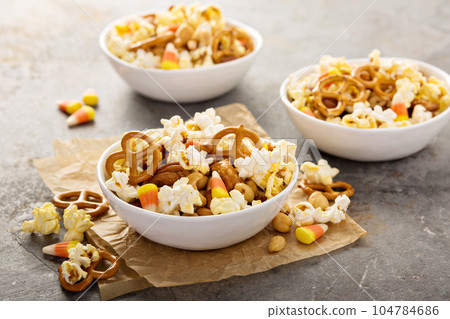 Homemade Halloween trail mix with popcorn, pretzels and nuts 104784686
