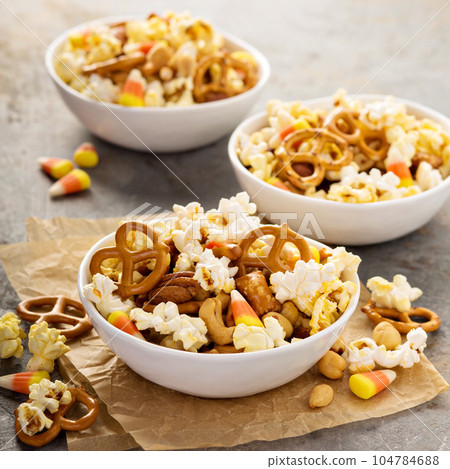 Homemade Halloween trail mix with popcorn, pretzels and nuts 104784688