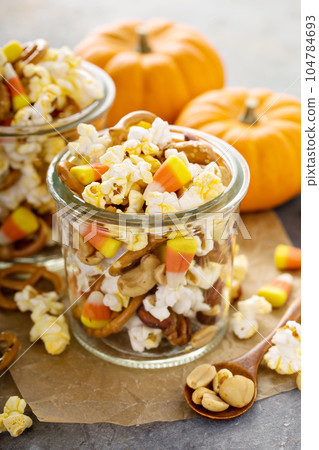 Homemade Halloween trail mix with popcorn, pretzels and nuts 104784693