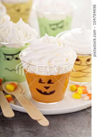 Funny Halloween themed puddings in cups Funny Halloween themed puddings in cups 104784696