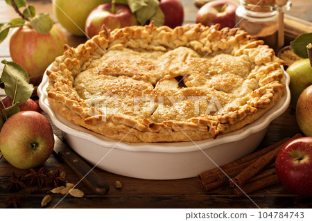 Apple pie decorated with fall leaves 104784743