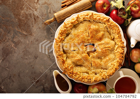 Apple pie decorated with fall leaves Apple pie decorated with fall leaves 104784792
