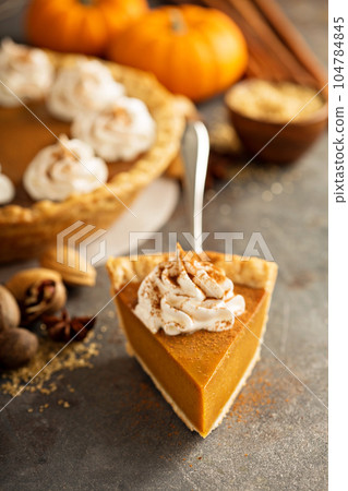 Pumpkin pie with whipped cream Pumpkin pie with whipped cream 104784845