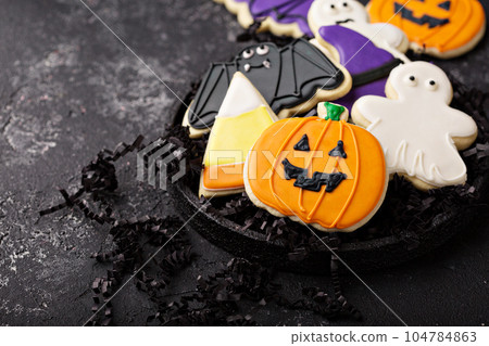 Halloween cookies decorated with royal icing 104784863