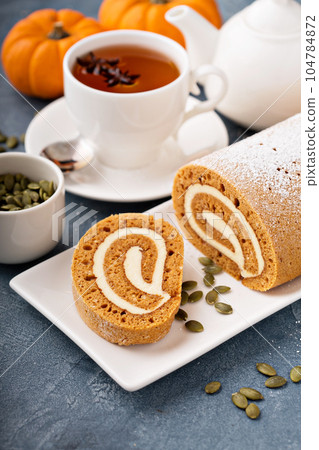 Pumpkin roll with cream cheese frosting Pumpkin roll with cream cheese frosting 104784872