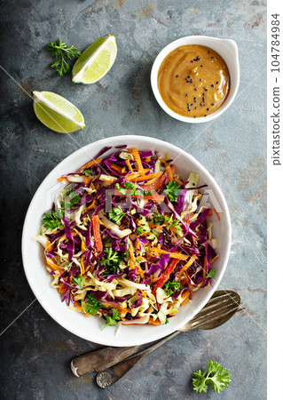 Asian cole slaw with peanut butter dressing Asian cole slaw with peanut butter dressing 104784984
