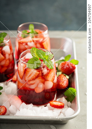 Strawberry ice tea or cold cocktail Strawberry ice tea or cold cocktail 104784997