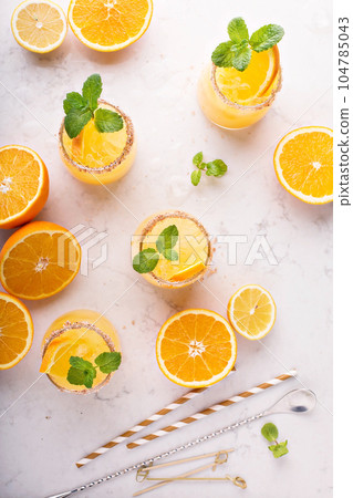Orange and lemon margarita cocktail Orange and lemon margarita cocktail 104785043