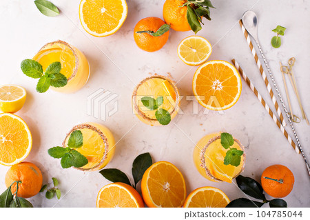 Orange and lemon margarita cocktail 104785044