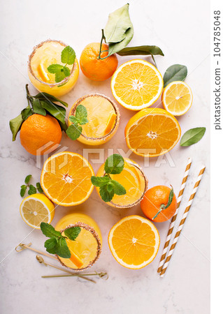 Orange and lemon margarita cocktail 104785048