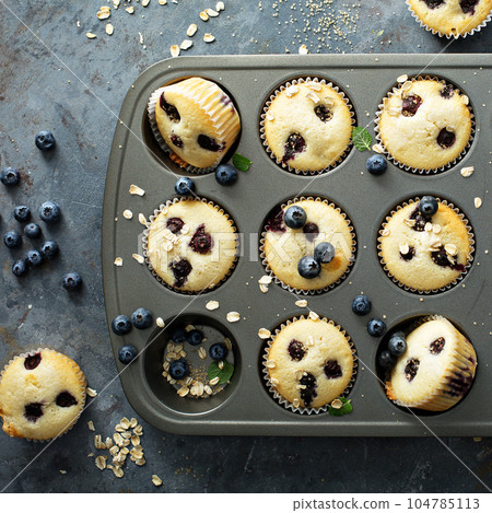 Blueberry muffins in a pan 104785113