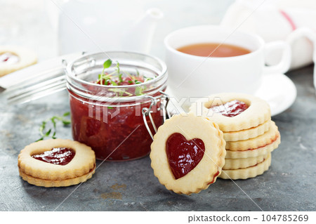 Vanilla cookies with strawberry filling 104785269