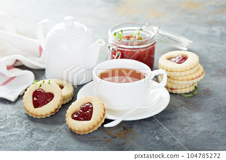 Vanilla cookies with strawberry filling 104785272
