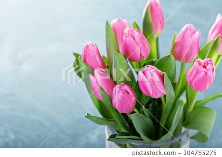 Pink tulips in a glass vase Pink tulips in a glass vase 104785275
