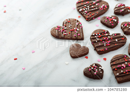 Chocolate cookies with sprinkles for Valentines Day Chocolate cookies with sprinkles for Valentines Day 104785280