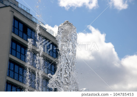 High jets of water fountain in the city High jets of water fountain in the city 104785453