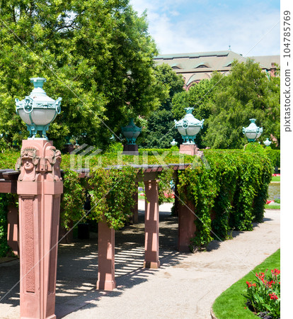 Pergola and street lights in the public park. Mannheim Germany. Pergola and street lights in the public park. Mannheim Germany. 104785769
