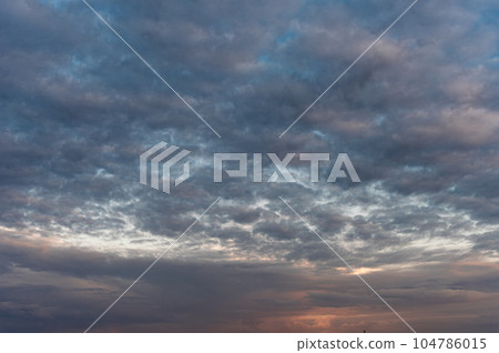 Cirrocumulus clouds and gaps of blue sky. Cirrocumulus clouds and gaps of blue sky. 104786015