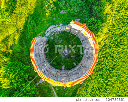 Ruins of old rural windmill in Pricovy near Sedlcany. The largest Dutch type mill. Czech Republic. Aerial view from drone. Ruins of old rural windmill in Pricovy near Sedlcany. The largest Dutch type mill. Czech Republic. Aerial view from drone. 104786861