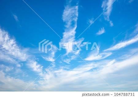 Clouds fluttering with the wind in the blue sky a-1 104788731