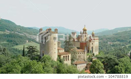 Aerial drone panoramic view of the Rocchetta Mattei castle in Italy on sunny summer day, view from above. High quality footage 104788819