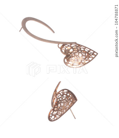 Fashion gold Earrings with beautiful work detail is value. Luxury golden earring is fashion trend and fly in air. White background isolated 104788871