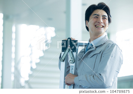 Man in work clothes Office building 104789875