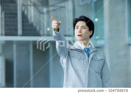 Man in work clothes Office building Man in work clothes Office building 104789878