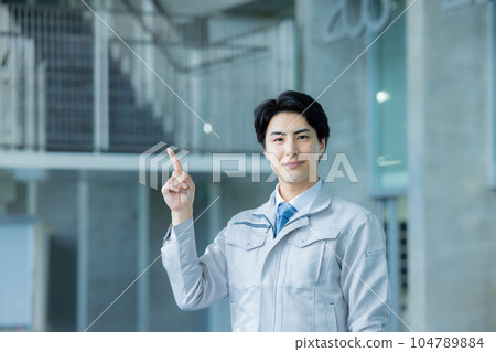 Man in work clothes Office building 104789884